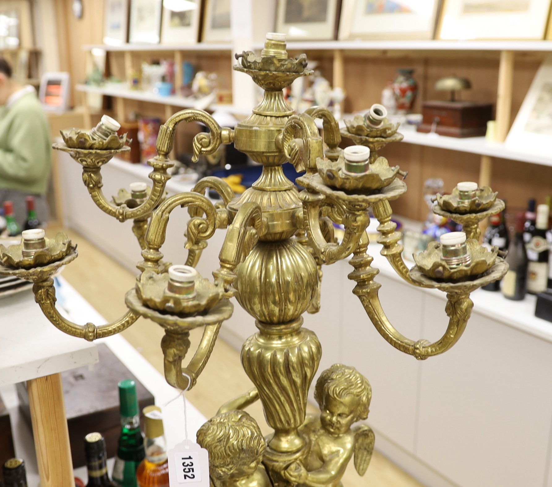 A pair of heavy brass candelabra, 85cm total height